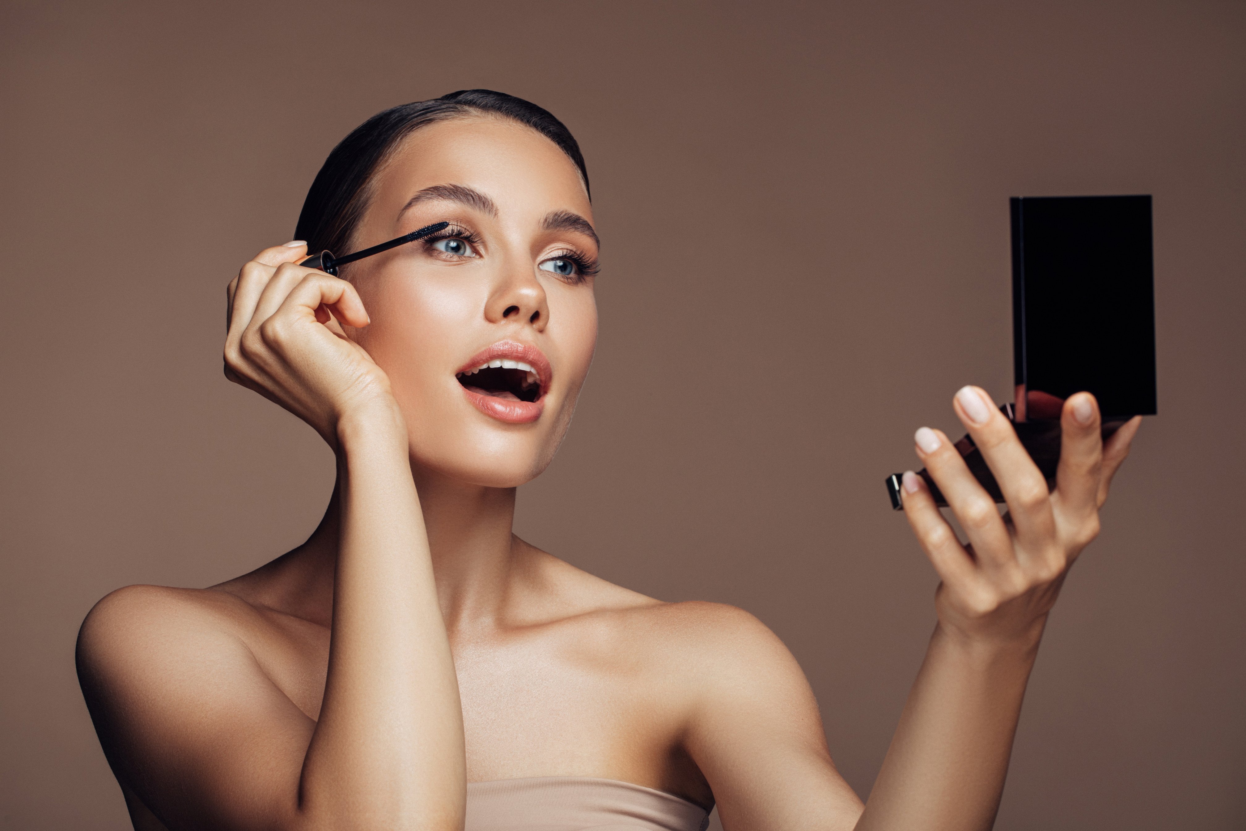 Woman applying make-up